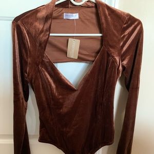 Brown brand new Vestique bodysuit with cut out back